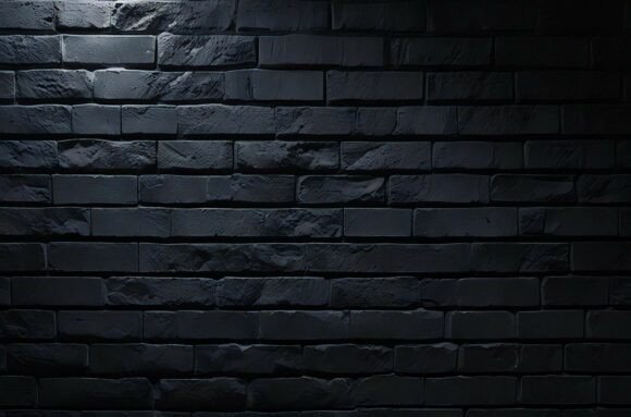A Black Brick Wall with a Light on It: A Versatile Design Resource