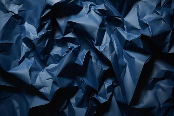 A Close Up of a Crumpled Blue Paper: A Versatile Design Asset for Creative Projects