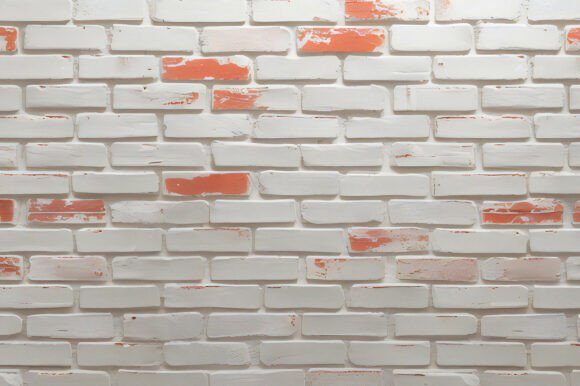 A White Brick Wall with Red Paint: A Versatile Creative Tool